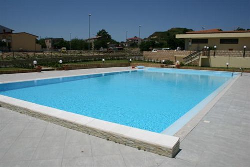 Baia Dei Canonici Aparthotel Villaggio Le Rocelle Exterior foto